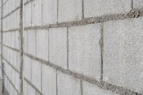 White cement brick wall pattern close-up.