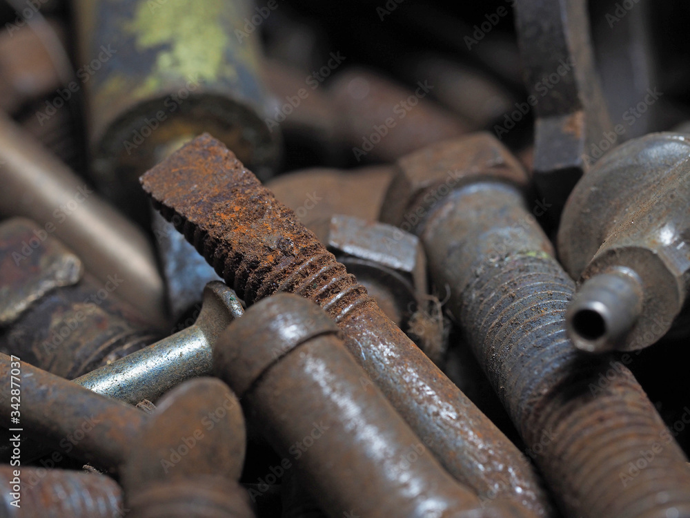 Dirty and rusty nuts and bolts close-up. Can be used as a background