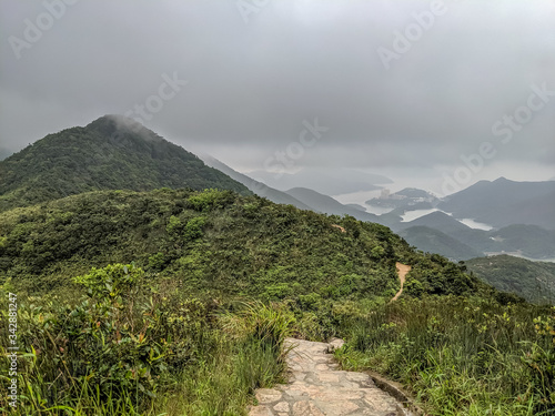 trail on a foggy day around hills in Hong Kong