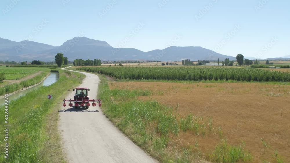 tractor goes field on road tractor goes field on road