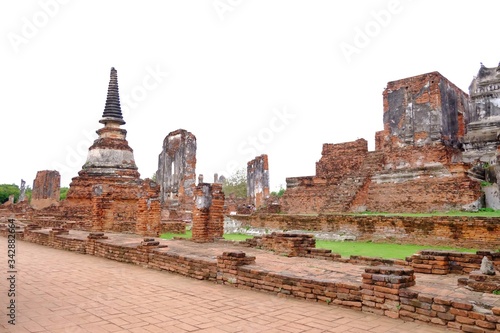 Ruin ancient pagoda at Wat Phra Sri Sanphet in Ayutthaya historical park area against white blue sky background in bright day 