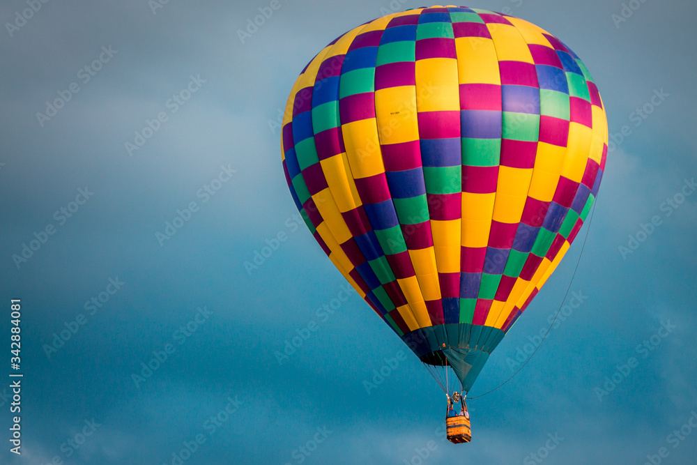 Fototapeta premium Close up shot of hot air balloon flying in the sky at an airshow