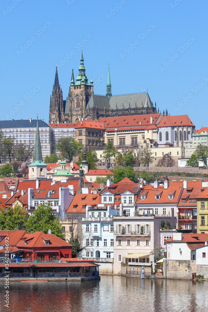 Fototapeta premium Stunning skyline of Prague, Czech Republic with dominant Prague Castle. The historical center of the Czech capital is located along river Vltava. Sunny day, clear sky. Beautiful Czechia