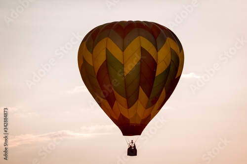 Hot air balloon floating by at sunset at an air show in Battle Creek Michigan photo