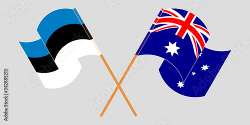 Crossed and waving flags of Australia and Estonia