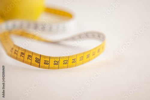 Green apples measured the meter.Healthy food for weight loss.
