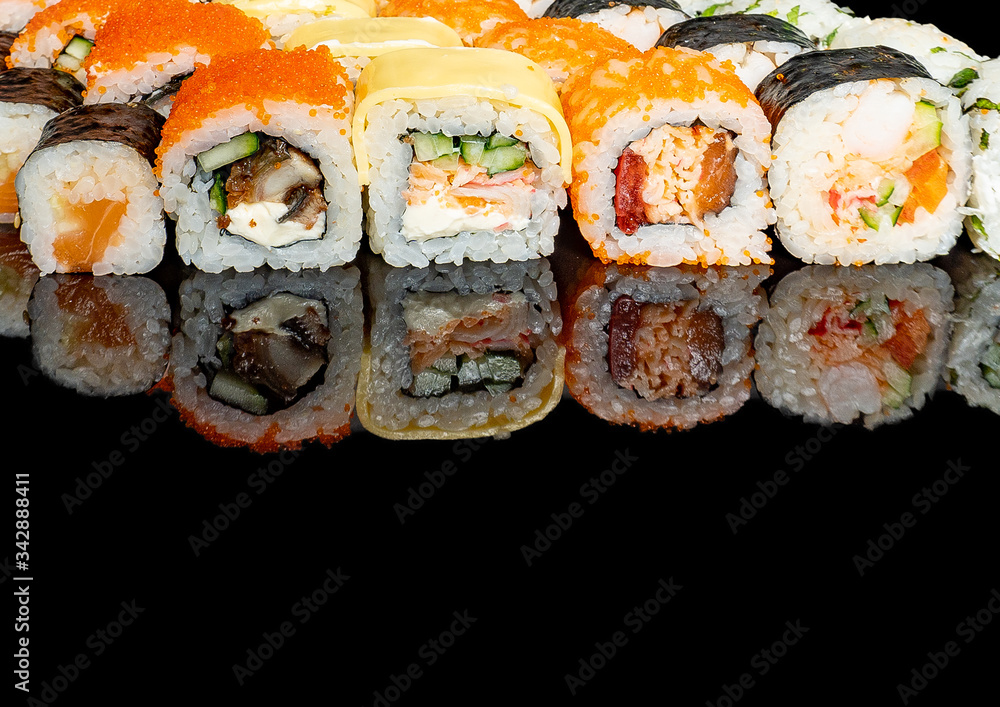 sushi on a black background with rice filling
sushi on a black background with rice filling