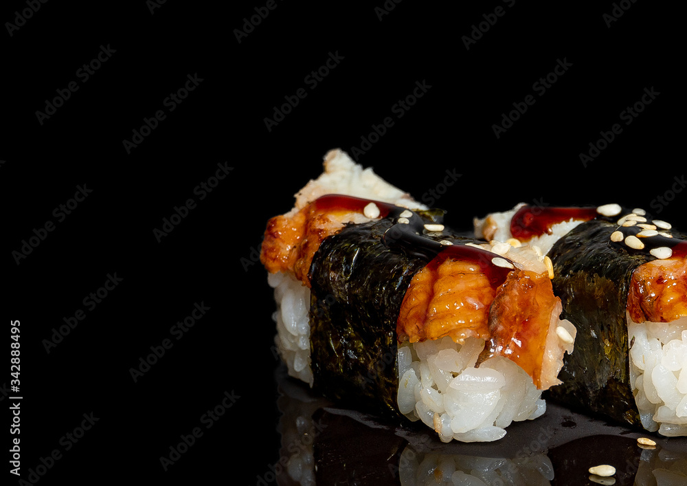 sushi on a black background with rice filling
sushi on a black background with rice filling
