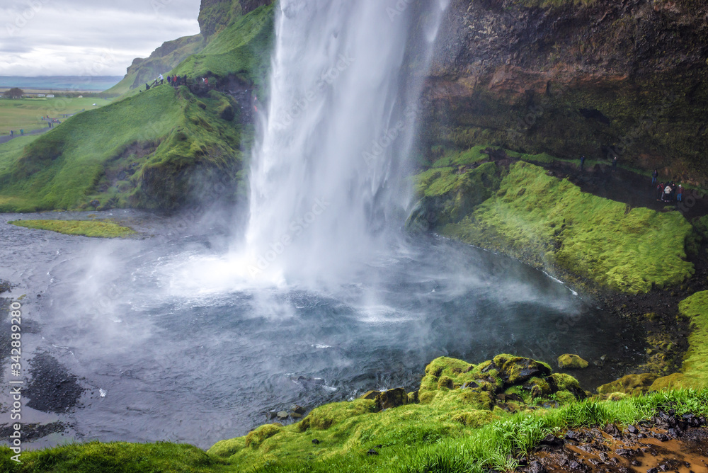 Famous Seljalandsfoss waterfall on Seljalands River that has its origin in volcano glacier Eyjafjallajokull, Iceland