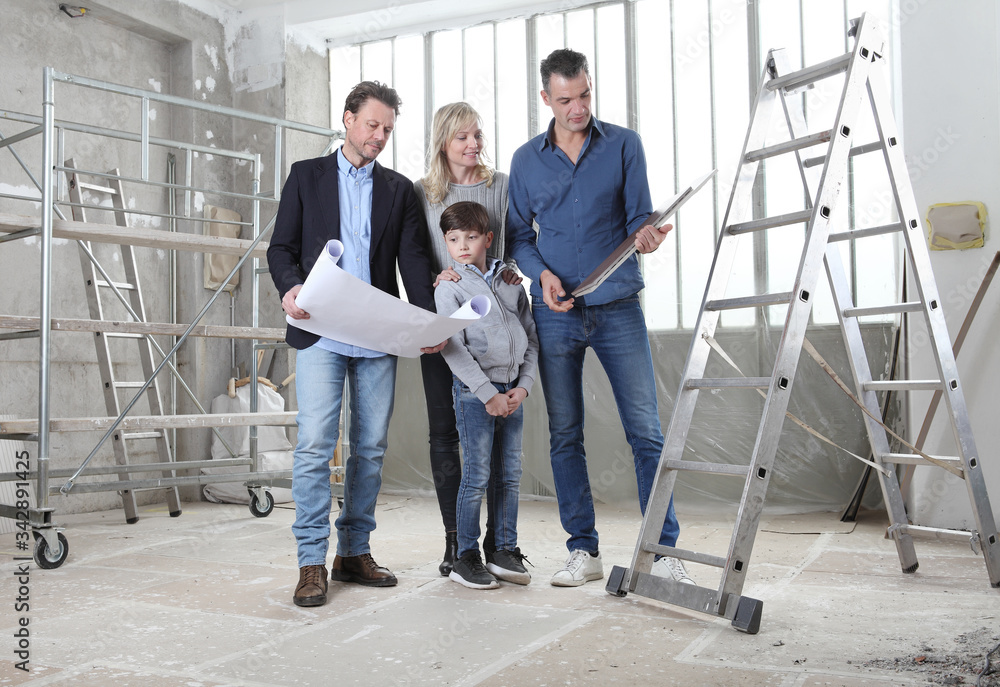 Fototapeta premium Architect showing house design plans to a family with child. Meeting at interior construction site to talk about house appearance, interior decoration, home layout and floor tiles