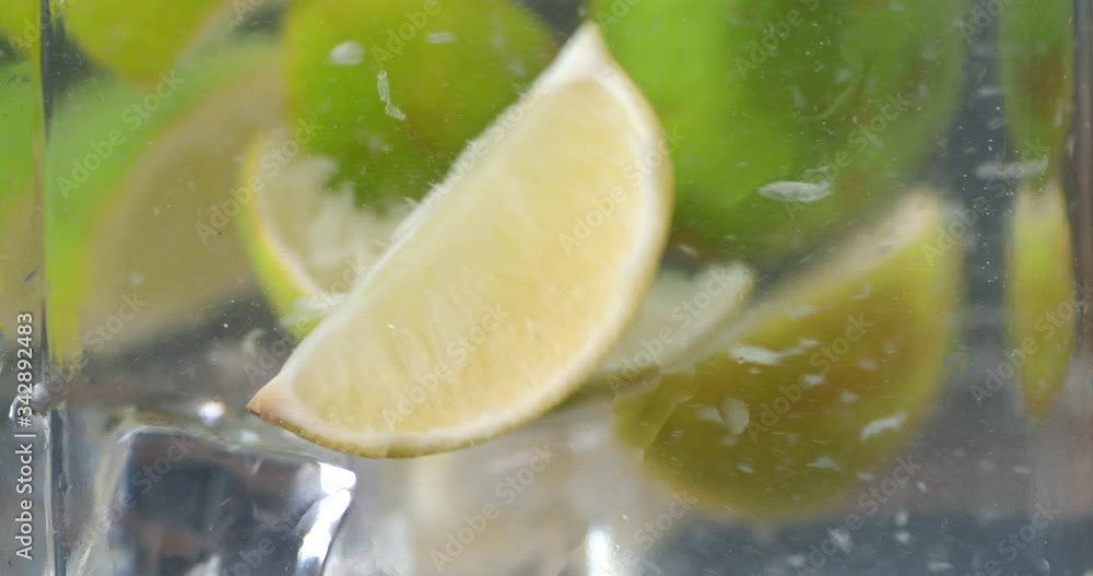 The slices of lime with ice under water.
