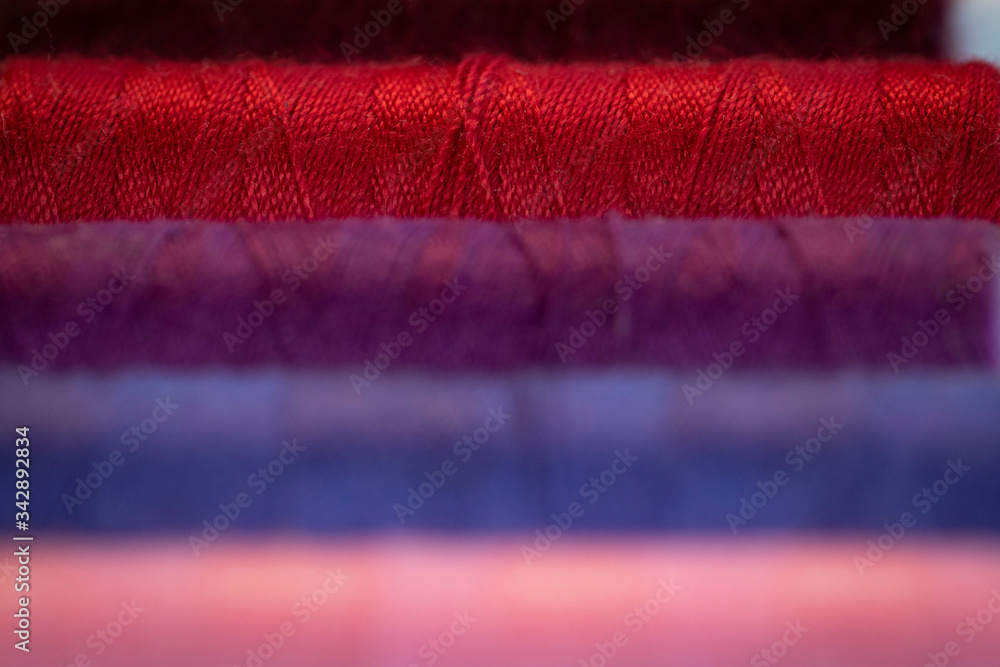 Close up of colorful thread, Ariadne's thread, One thing led to another Close up of colorful thread, Ariadne's thread, One thing led to another