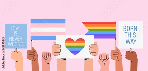 People hold signs, banner and placards with lgbt rainbow and transgender flag during pride month celebration against violence, descrimination, human rights violation. Equality and self-affirmarmation.