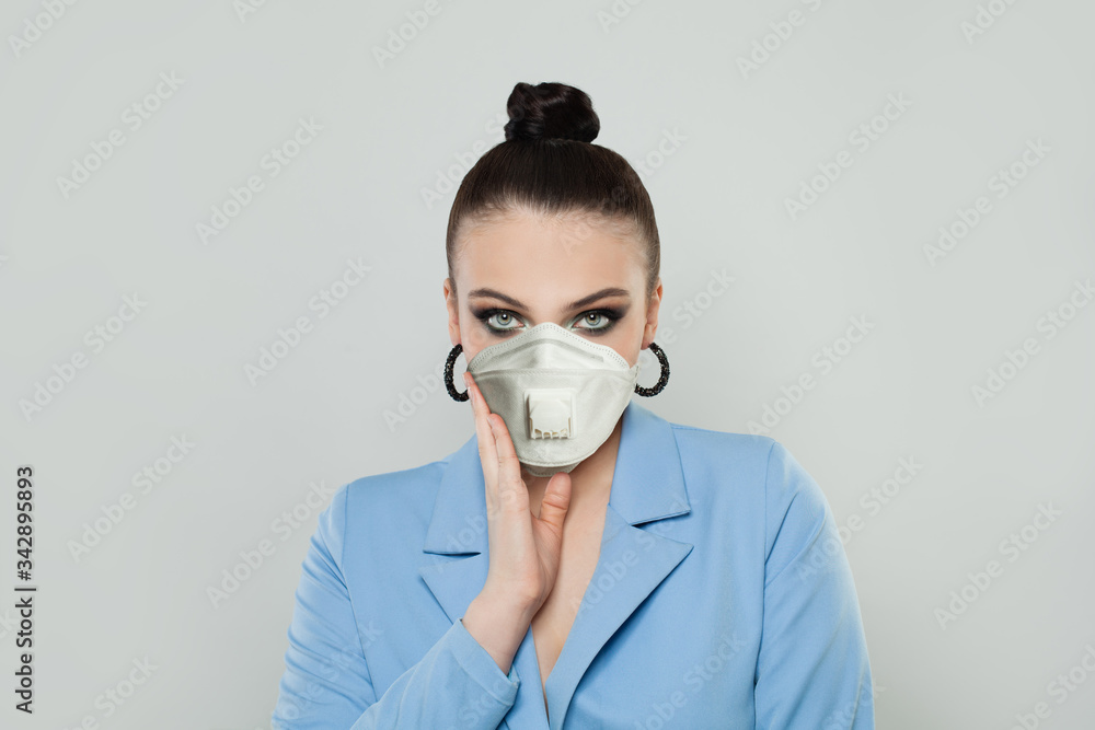 Woman wearing a medical mask on white background Woman wearing a medical mask on white background