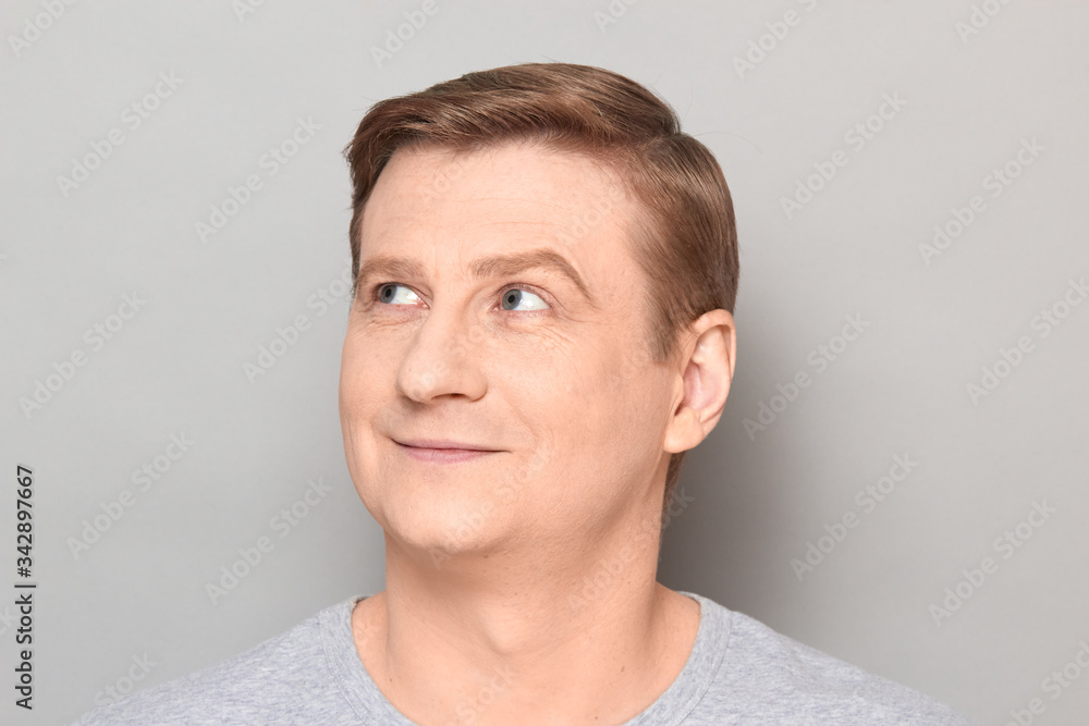 Portrait of blond mature man with happy expression and smiling Portrait of blond mature man with happy expression and smiling
