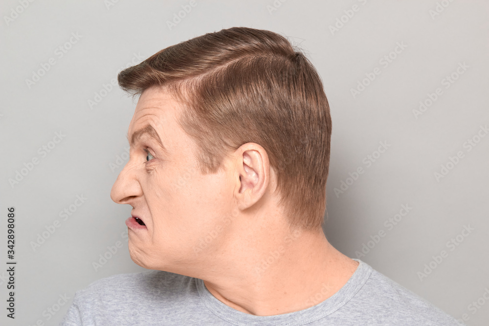 Fototapeta premium Portrait of blond mature man with angry annoyed expression