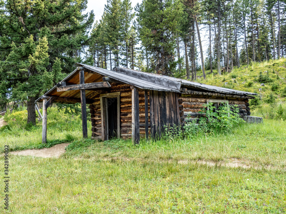 Abandoned log buildings in western ghost town. Abandoned log buildings in western ghost town.