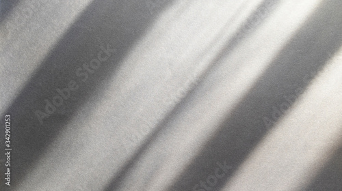 Diagonal shadows on blue dark gray paper. Abstract backgorund. Stock photo.