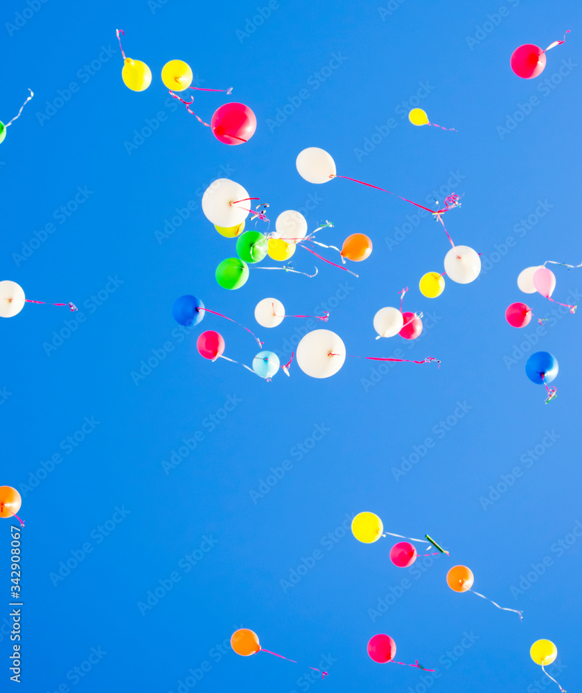 colorful balloons flying in the blue sky colorful balloons flying in the blue sky
