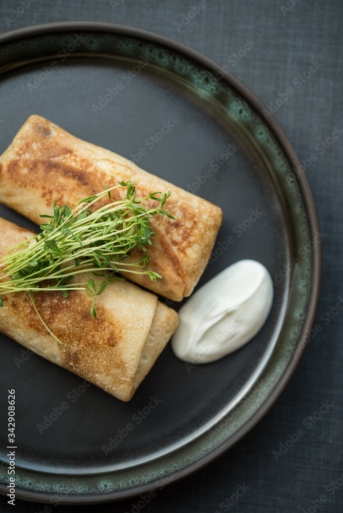 Filled pancakes with sour cream Filled pancakes with sour cream