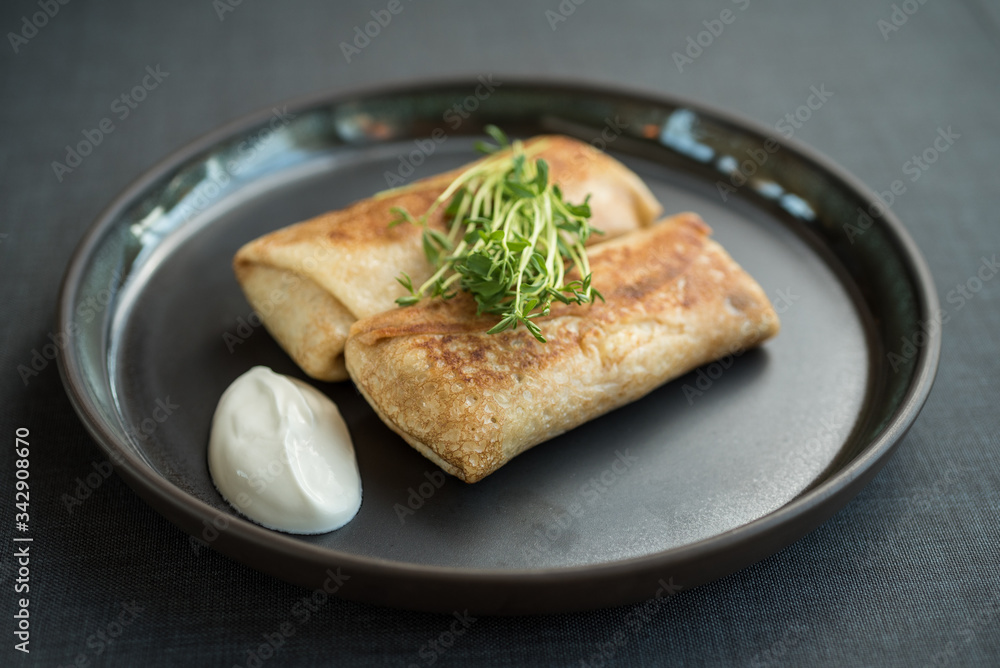 Filled pancakes with sour cream Filled pancakes with sour cream