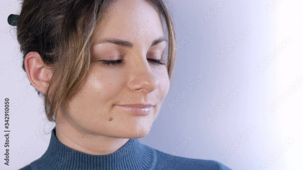 Portrait of beautiful happy young woman or girl with blond hair and green eyes looking seriously and thoughtfully to the side on white background... Portrait of beautiful happy young woman or girl with blond hair and green eyes looking seriously and thoughtfully to the side on white background...