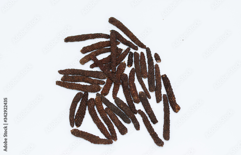 Fototapeta premium Long pepper or Piper longum on white background Long black pepper (Also called as Pipli in Indian, capsicum frutescens, Balinese pepper, Jaborandi pepper, Bengal pepper, Dipli in Thai, Piper longum)