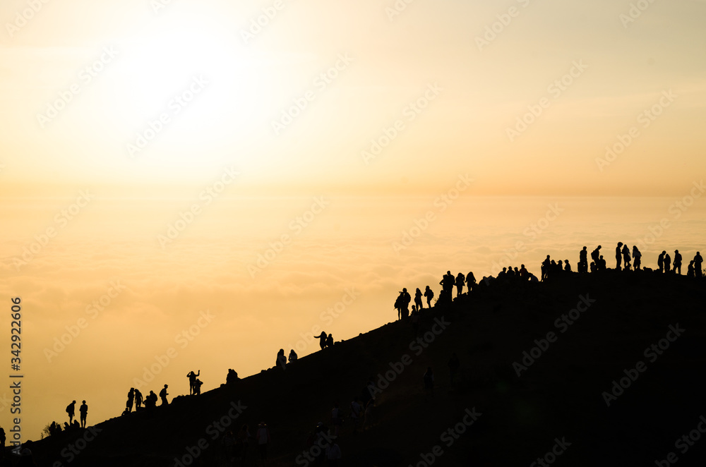 Beautiful sunset view from Apu Siqay with the silhouette of unrecognizable people, located in Lima - Peru