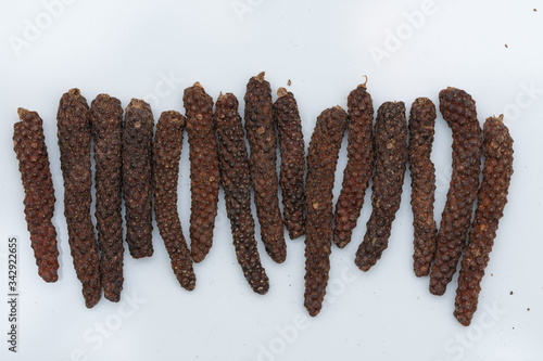 Long pepper or Piper longum on white background
Long black pepper (Also called as Pipli in Indian, capsicum frutescens, Balinese pepper, Jaborandi pepper, Bengal pepper, Dipli in Thai, Piper longum) photo