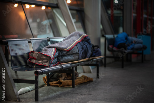 homeless man sleeping on the street