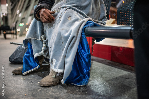 homeless man sleeping on the street