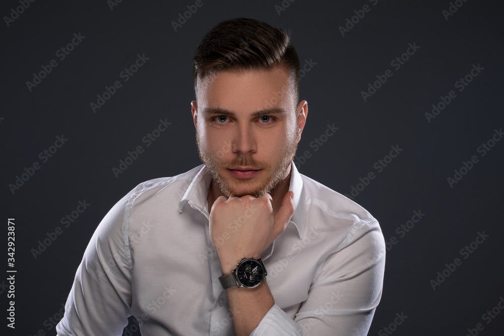 Obraz premium Portrait of beautiful man on grey background. Studio Isolated