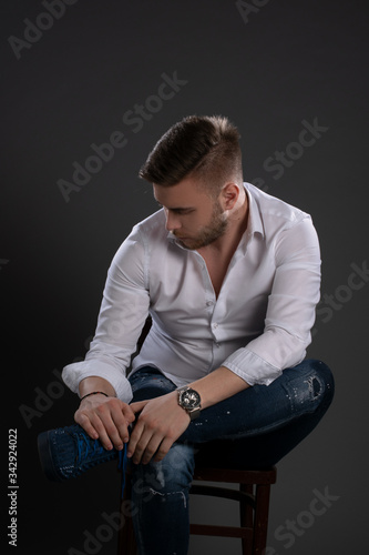 Portrait of beautiful man on grey background. Studio Isolated © Bogdan