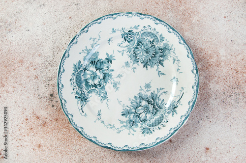 Antique porcelain dish on concrete