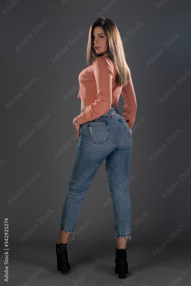 Portrait of girl posing in studio on grey background. Isolated Portrait of girl posing in studio on grey background. Isolated