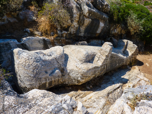 Kouros statue near Apollonas village in Naxos island, Cyclades, Greece photo