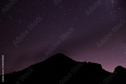 Mountain with a purple star sky