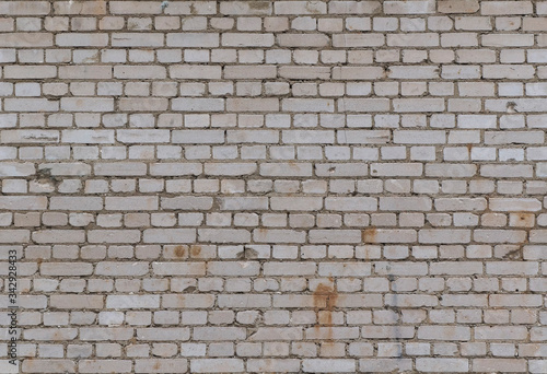 Full frame image of the gray grunge brick wall. Seamless texture of the white calcium silicate bricks for wallpaper or background