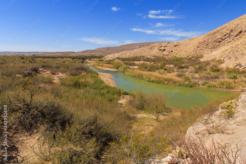 The Rio Grande river divides the border of Mexico and Texas. Looking over into Big Bend National Park from the Boquillas side of the park in Mexico.