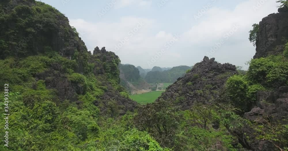 Aerial view of Tam Coc Bich Dong, part of the Trang An Scenic Landscape Complex UNESCO World Heritage site, Ninh Binh. Tam Coc is a flooded cave karst system, Bich Dong is a series of moutain pagodas Aerial view of Tam Coc Bich Dong, part of the Trang An Scenic Landscape Complex UNESCO World Heritage site, Ninh Binh. Tam Coc is a flooded cave karst system, Bich Dong is a series of moutain pagodas