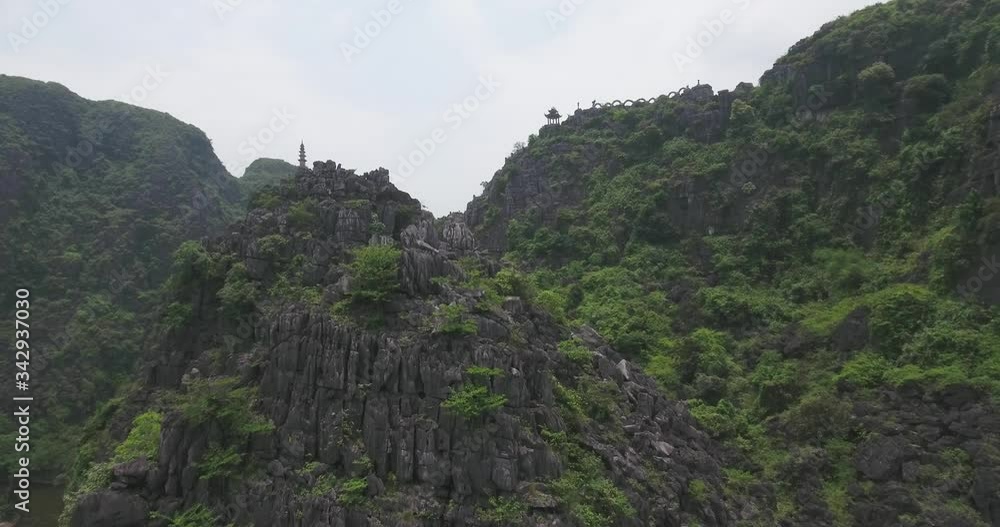 Aerial view of Tam Coc Bich Dong, part of the Trang An Scenic Landscape Complex UNESCO World Heritage site, Ninh Binh. Tam Coc is a flooded cave karst system, Bich Dong is a series of moutain pagodas Aerial view of Tam Coc Bich Dong, part of the Trang An Scenic Landscape Complex UNESCO World Heritage site, Ninh Binh. Tam Coc is a flooded cave karst system, Bich Dong is a series of moutain pagodas