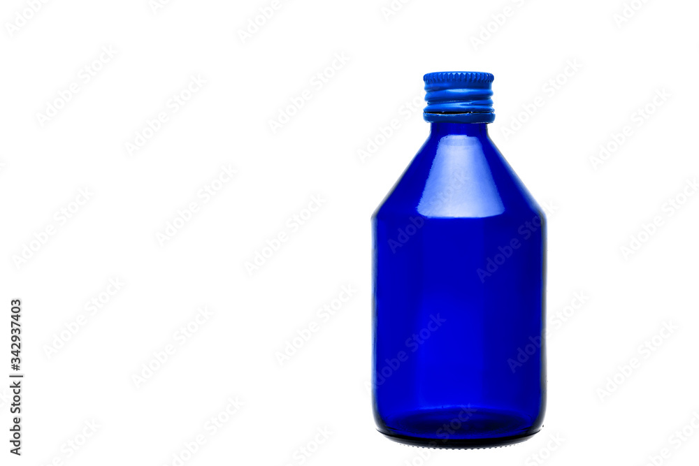 blue glass bottle with medical alcohol for disinfection with a metal cap isolated on a white background with copy space. blue glass bottle with medical alcohol for disinfection with a metal cap isolated on a white background with copy space.