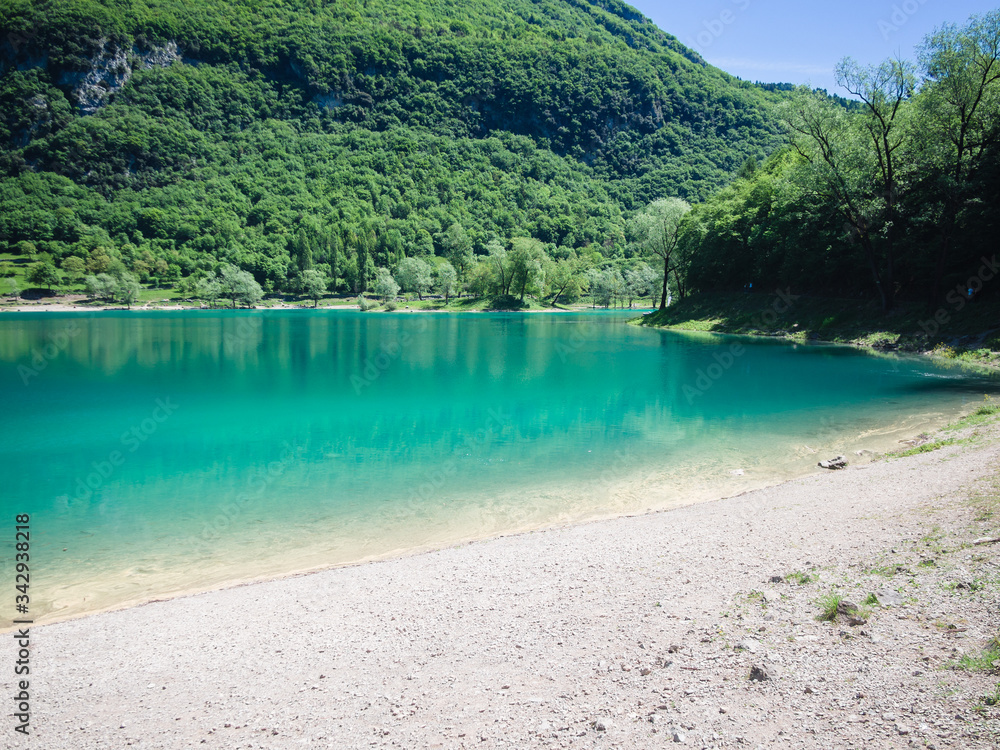 Lake Tenno surrounded by Italian alps.