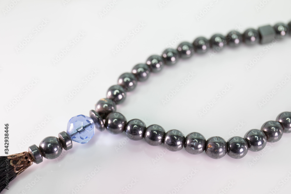 Closeup of prayer beads on white background Closeup of prayer beads on white background
