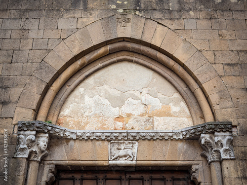 Detail of the arch of the imposing 13th century portal of the church of San Francesco in Pienza, Italy.
