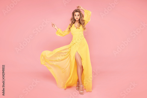 Beautiful lady in flowing yellow dress.