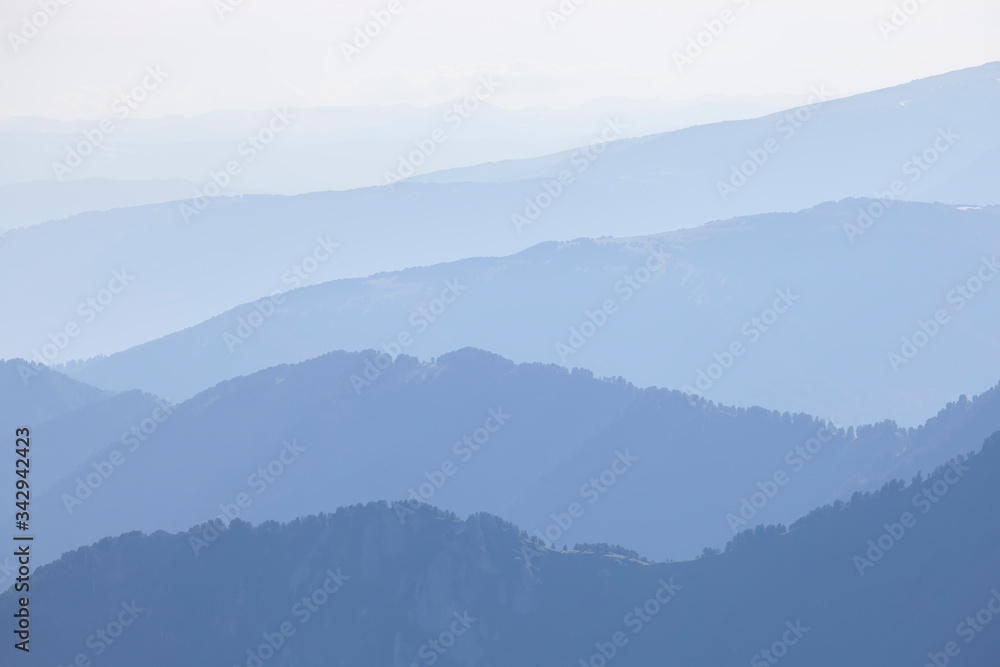 Mountains in the morning haze, blue natural background Mountains in the morning haze, blue natural background