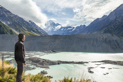 Man alone contemplating nature. Mount Cook, New Zealand.