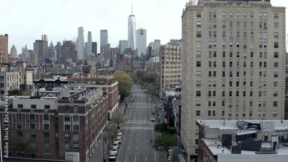 aerial moving toward Freedom Tower over empty 6th Avenue Manhattan New York City street during coronavirus COVID-19 pandemic quarantine lockdown drone shot NYC