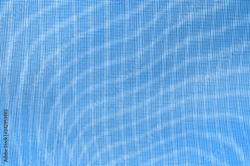 abstraction background: unique wavy pattern of overlaying two grids, blurry and tinted to classic blue